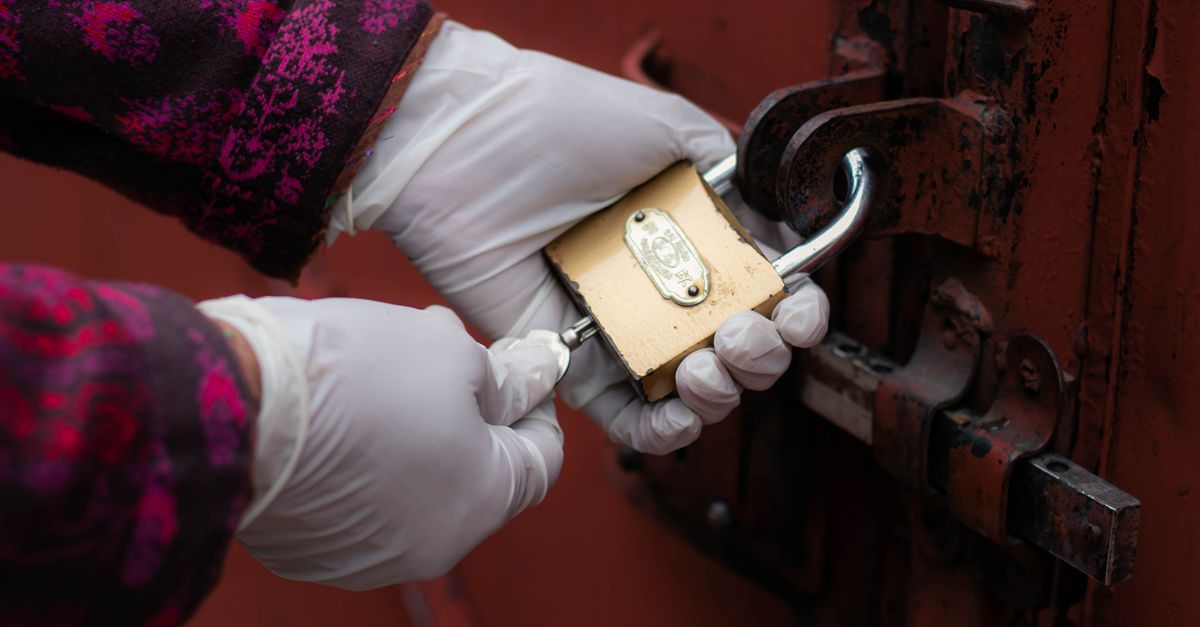 locksmith unlocking front door — John Locksmiths